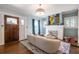 Bright living room features hardwood floors, fireplace, and a dark wood front door at 902 E Ponce De Leon Ave, Decatur, GA 30030