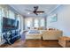 Bright living room featuring hardwood floors, neutral decor, and a cozy seating area at 902 E Ponce De Leon Ave, Decatur, GA 30030