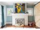 Cozy living room with white fireplace, colorful artwork, and sliding barn door at 902 E Ponce De Leon Ave, Decatur, GA 30030