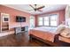 Bright primary bedroom with hardwood flooring, a ceiling fan, and ample natural light at 902 E Ponce De Leon Ave, Decatur, GA 30030