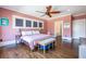 Serene bedroom with hardwood floors and a view into the main bathroom at 902 E Ponce De Leon Ave, Decatur, GA 30030