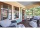 Relaxing screened-in porch with comfortable seating and a view of the outdoors at 902 E Ponce De Leon Ave, Decatur, GA 30030