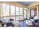 Relaxing screened porch with wicker chairs and plenty of natural light at 902 E Ponce De Leon Ave, Decatur, GA 30030