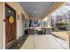 Inviting front porch with seating area and a charming sunflower decoration on the door at 902 E Ponce De Leon Ave, Decatur, GA 30030