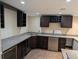 Basement bar area with granite countertops and stainless steel appliances at 4401 Riverlake Way, Snellville, GA 30039