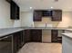 Basement bar area with granite countertops and stainless steel appliances at 4401 Riverlake Way, Snellville, GA 30039