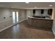 Spacious finished basement with tile floors, bar, and recessed lighting offers a great entertainment space at 4401 Riverlake Way, Snellville, GA 30039