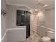 Bathroom featuring a large walk-in shower with glass door and tile flooring at 4401 Riverlake Way, Snellville, GA 30039