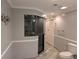 Bathroom featuring a large walk-in shower with glass door and tile flooring at 4401 Riverlake Way, Snellville, GA 30039