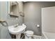 Cozy bathroom featuring gray walls and classic fixtures, creating a functional space at 5074 Pittman Rd, Cumming, GA 30040