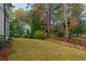 Picturesque backyard featuring a well-manicured lawn, mature trees, and a privacy fence at 660 Timm Valley Ne Rd, Atlanta, GA 30305