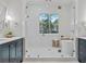 Luxurious bathroom featuring a soaking tub, glass shower, and double vanity sinks at 660 Timm Valley Ne Rd, Atlanta, GA 30305