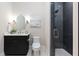 Stylish bathroom featuring a walk-in shower, a vanity, and a toilet at 660 Timm Valley Ne Rd, Atlanta, GA 30305