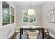 Cozy dining area with a stylish light fixture, modern decor and views of outdoors at 660 Timm Valley Ne Rd, Atlanta, GA 30305