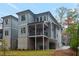 Rear exterior view of a modern home with a covered patio, perfect for outdoor entertaining at 660 Timm Valley Ne Rd, Atlanta, GA 30305