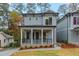 Charming two-story home with a welcoming front porch and well-maintained landscaping at 660 Timm Valley Ne Rd, Atlanta, GA 30305