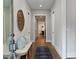 Hallway features hardwood floors, a bench, and a decorative mirror at 660 Timm Valley Ne Rd, Atlanta, GA 30305
