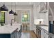 Modern kitchen featuring a large center island with white countertops and stainless steel appliances at 660 Timm Valley Ne Rd, Atlanta, GA 30305