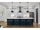 Bright kitchen features stainless steel appliances, a large island with seating, and pendant lighting at 660 Timm Valley Ne Rd, Atlanta, GA 30305