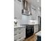 Gourmet kitchen with stainless steel appliances, white cabinets and sleek countertops at 660 Timm Valley Ne Rd, Atlanta, GA 30305