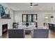 Elegant living room featuring a fireplace, stylish furniture, and seamless indoor-outdoor flow at 660 Timm Valley Ne Rd, Atlanta, GA 30305