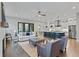 Open-concept living room with hardwood floors, fireplace, and connection to the kitchen at 660 Timm Valley Ne Rd, Atlanta, GA 30305