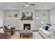 Comfortable living room with fireplace, modern decor and ample natural light at 660 Timm Valley Ne Rd, Atlanta, GA 30305