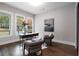 Bright home office with hardwood floors, three large windows, and a cowhide rug at 660 Timm Valley Ne Rd, Atlanta, GA 30305