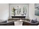 Bright home office with hardwood floors, three large windows, and a cowhide rug at 660 Timm Valley Ne Rd, Atlanta, GA 30305