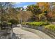 Scenic park path with manicured landscaping and decorative fencing on each side at 660 Timm Valley Ne Rd, Atlanta, GA 30305