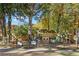 Community playground with slides and climbing structure, surrounded by mature trees at 660 Timm Valley Ne Rd, Atlanta, GA 30305