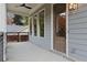 Inviting front porch with stylish details, including a ceiling fan and a view of the surrounding landscape at 660 Timm Valley Ne Rd, Atlanta, GA 30305