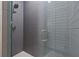 Modern shower featuring sleek gray subway tile, glass doors, and a rainfall showerhead at 660 Timm Valley Ne Rd, Atlanta, GA 30305