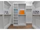 A spacious walk-in closet features custom shelving and hanging racks, providing ample storage for clothing and accessories at 660 Timm Valley Ne Rd, Atlanta, GA 30305