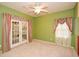 Bedroom with carpet, bright walls, and a double french door at 23 Wesley Dr, Acworth, GA 30101