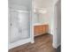 Bathroom featuring tile floors, shower, and wooden cabinets at 5132 Silhouette Sw Ln, Mableton, GA 30126