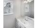 Well-lit bathroom with a large mirror, vanity, and natural light at 5132 Silhouette Sw Ln, Mableton, GA 30126