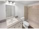 Bathroom featuring a tiled shower, a vanity with sink, a mirror, and modern fixtures at 5132 Silhouette Sw Ln, Mableton, GA 30126