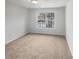 Simple carpeted bedroom with natural light from the window at 5132 Silhouette Sw Ln, Mableton, GA 30126