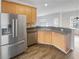 Kitchen featuring stainless steel fridge, wooden cabinets, and a stainless steel sink at 5132 Silhouette Sw Ln, Mableton, GA 30126