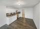 Kitchen features modern cabinets, a dual sink, hardwood flooring, and a tiled backsplash at 5132 Silhouette Sw Ln, Mableton, GA 30126
