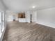 Open-concept living room boasts stylish flooring and seamless flow into the kitchen area at 5132 Silhouette Sw Ln, Mableton, GA 30126