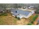 Aerial shot of backyard featuring patio, roof, and lush landscaping at 334 Nancy Sw Ct, Lilburn, GA 30047