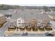 Aerial view of townhomes in a well-planned community with street parking at 3374 Grey St, Duluth, GA 30096