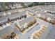 Community aerial view featuring multiple townhomes with street parking and common areas at 3374 Grey St, Duluth, GA 30096