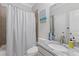 Bathroom with a shower and bathtub, a toilet, and a vanity featuring granite countertops, plus decorative wall art at 3374 Grey St, Duluth, GA 30096