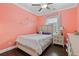 Charming bedroom with an accent painted wall and a large window providing natural light at 3374 Grey St, Duluth, GA 30096