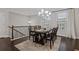 Elegant dining room featuring a dark wood table and ample natural light at 3374 Grey St, Duluth, GA 30096