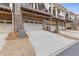 Row of townhomes featuring garages and well-maintained landscaping at 3374 Grey St, Duluth, GA 30096
