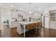 Spacious kitchen with modern appliances, center island, and hardwood floors at 3374 Grey St, Duluth, GA 30096